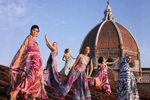 a group of people standing in front of a building